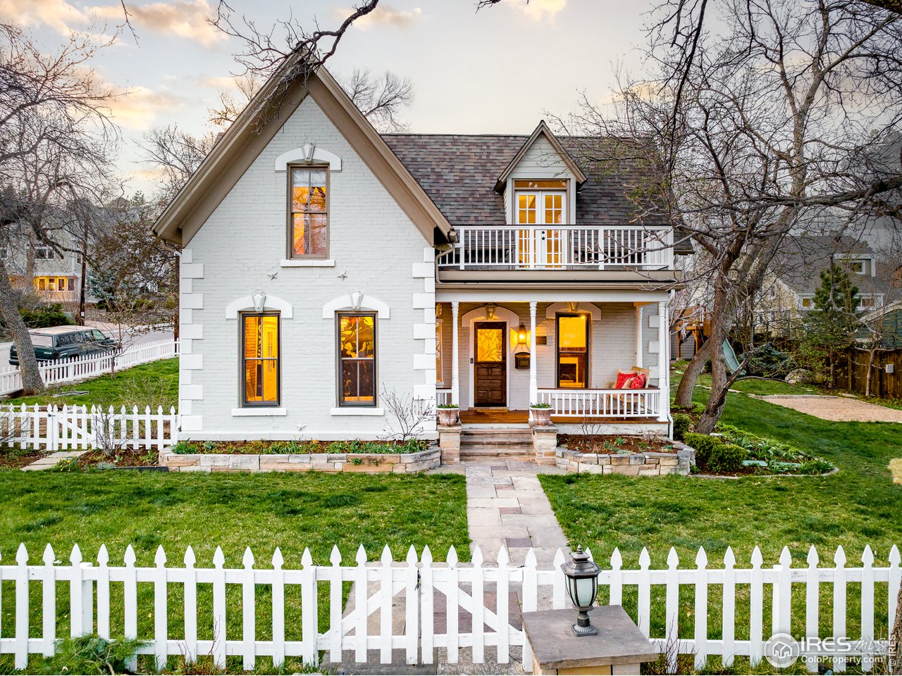 2303 Bluff Street Boulder, CO 80304 - Photo 1 of 40 a front view of a house with a yard table and chairs