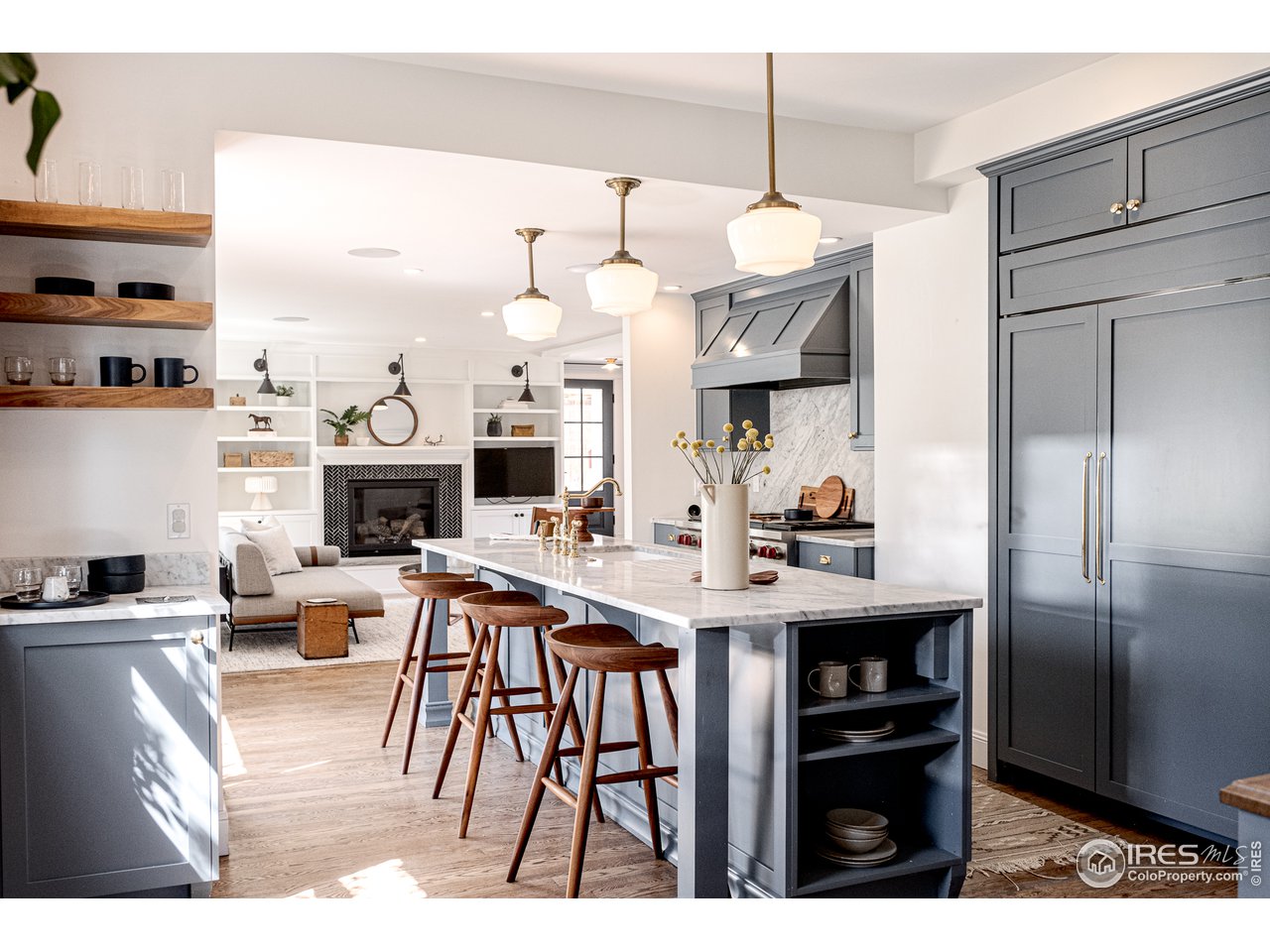 2303 Bluff Street Boulder, CO 80304 - Photo 16 of 40 a living room with furniture a fireplace and a kitchen view