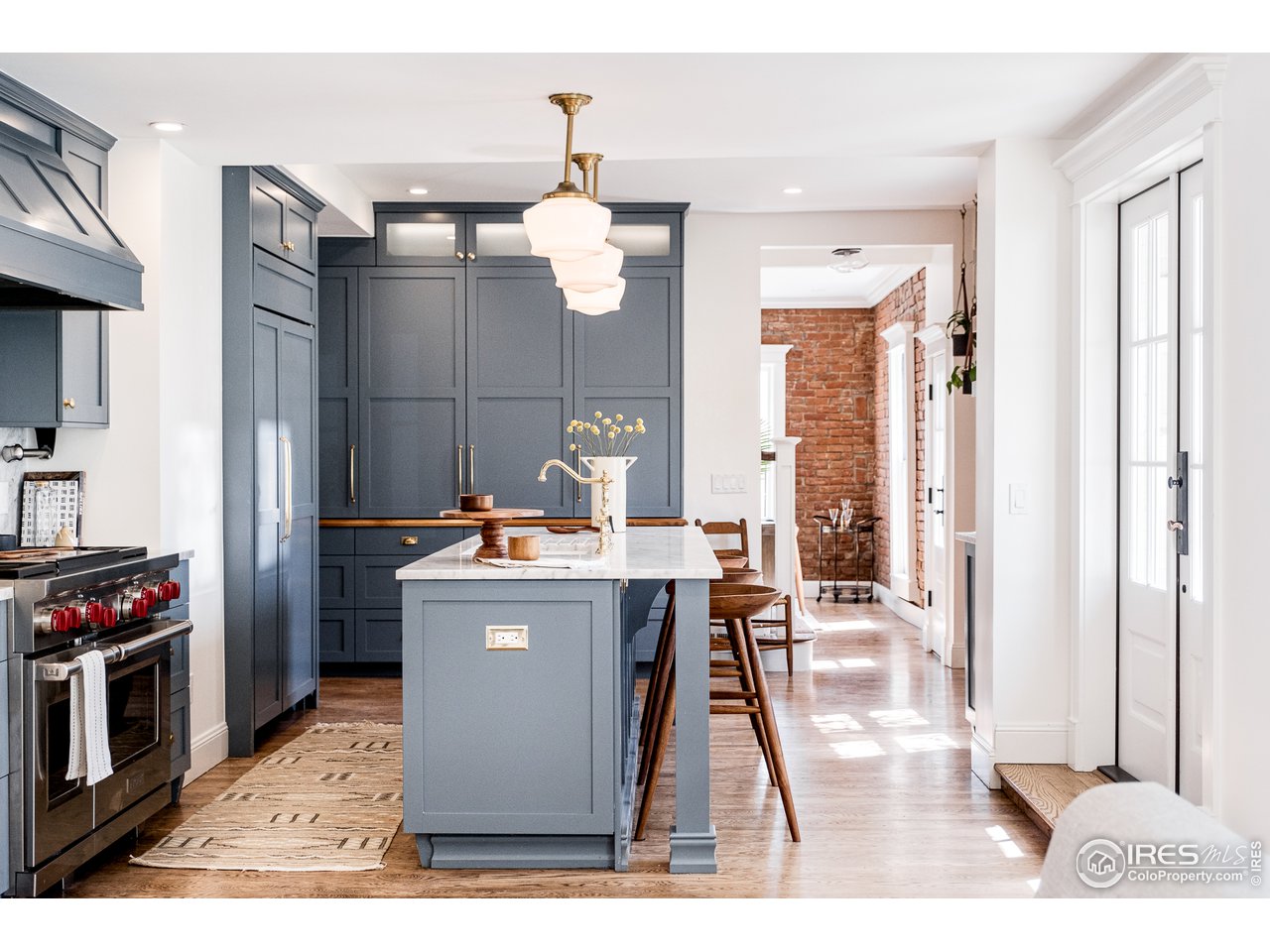 2303 Bluff Street Boulder, CO 80304 - Photo 19 of 40 a kitchen view with stainless steel appliances kitchen island granite countertop a stove and a sink