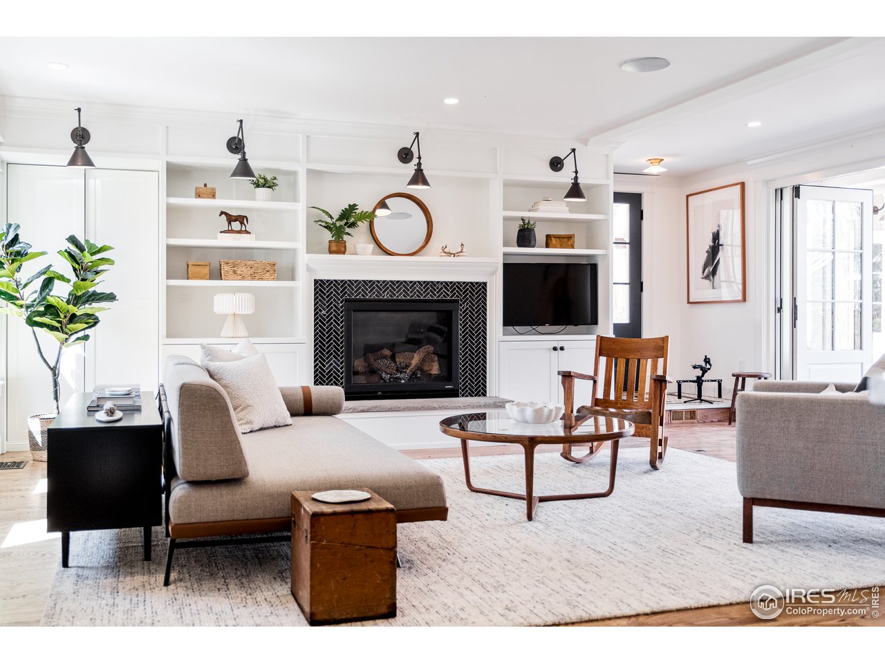 2303 Bluff Street Boulder, CO 80304 - Photo 21 of 40 a living room with furniture a flat screen tv and a fireplace