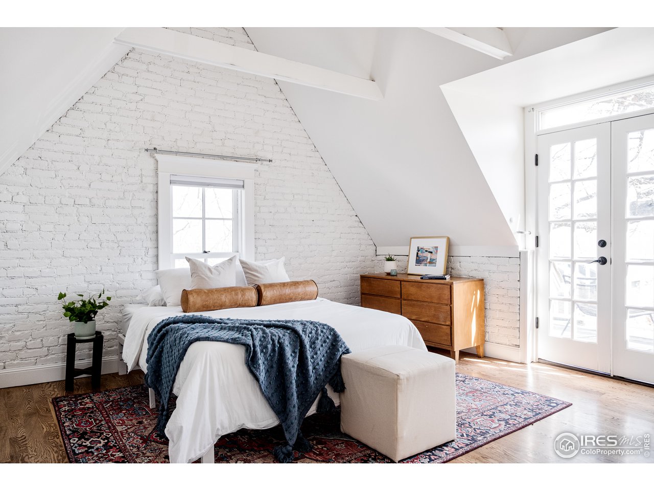 2303 Bluff Street Boulder, CO 80304 - Photo 35 of 40 a bedroom with a bed a table and chair