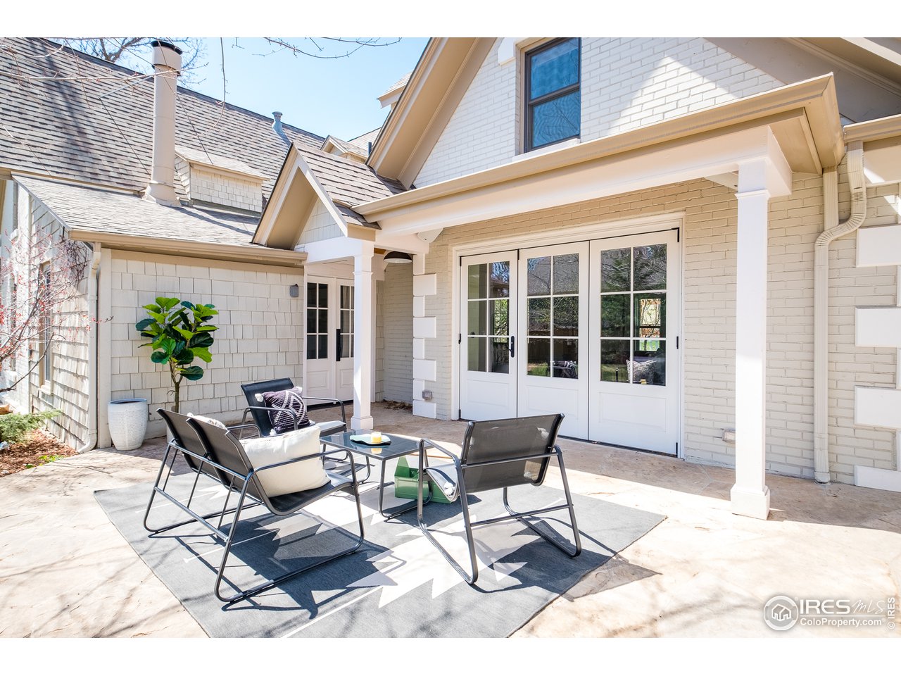 2303 Bluff Street Boulder, CO 80304 - Photo 37 of 40 a building outdoor space with patio furniture and potted plants
