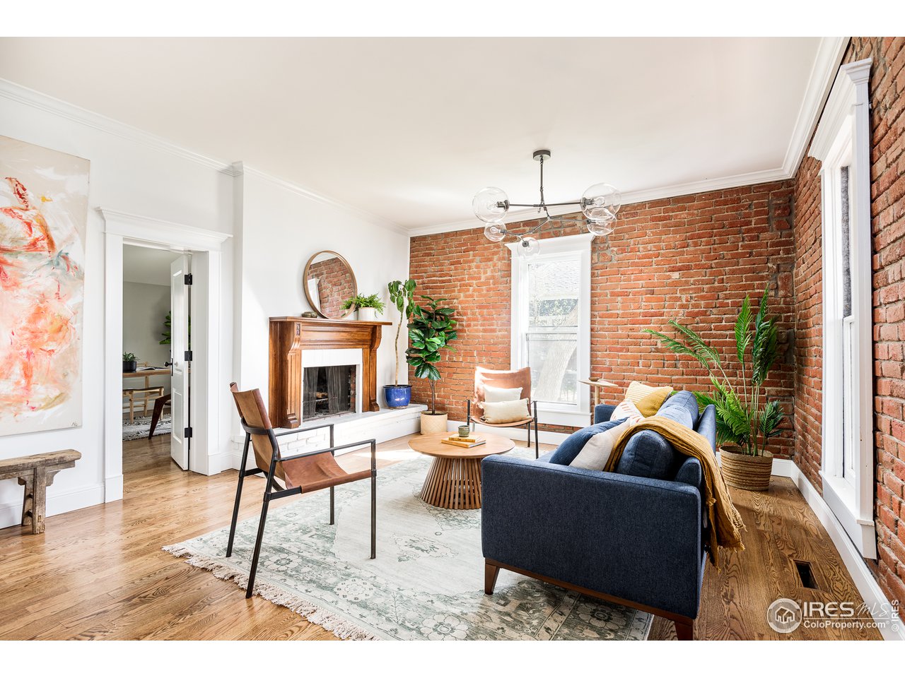 2303 Bluff Street Boulder, CO 80304 - Photo 7 of 40 a living room with furniture a fireplace and a floor to ceiling window