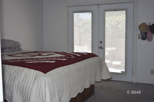 516 South Sorrel Street Ridgecrest, CA 93555 - Photo 16 of 32 a bedroom with a bed and window