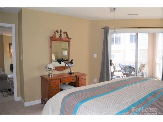 1313 Torrence Circle Davidson, NC 28036 - Photo 11 of 20 a bedroom with a bed and a large window