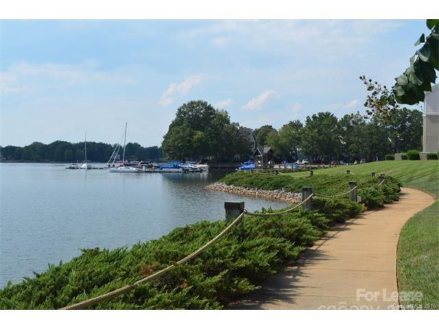1313 Torrence Circle Davidson, NC 28036 - Photo 20 of 20 a view of a lake with houses in the back
