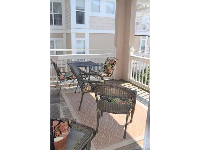 1313 Torrence Circle Davidson, NC 28036 - Photo 3 of 20 a view of a room with a table and chairs