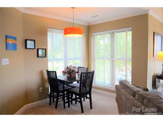 1313 Torrence Circle Davidson, NC 28036 - Photo 6 of 20 a view of a dining room with furniture window and outside view