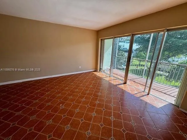 a view of an empty room with a balcony