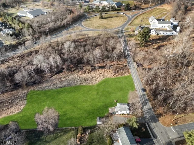 a view of a garden with lawn chairs