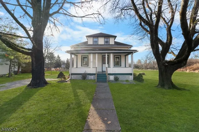 a view of a house with a backyard