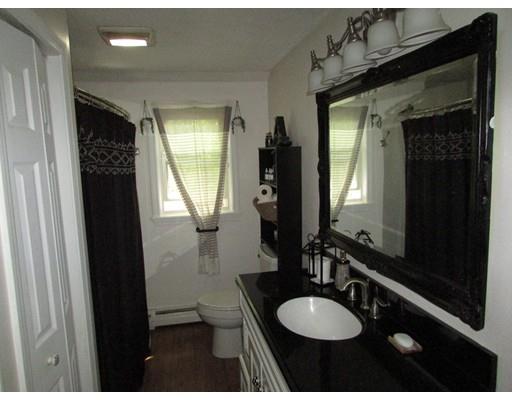 61 Searle Road Huntington, MA 01050 - Photo 12 of 16 a bathroom with a granite countertop sink toilet and mirror