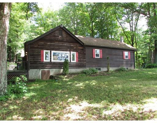 61 Searle Road Huntington, MA 01050 - Photo 3 of 16 a front view of a house with a yard