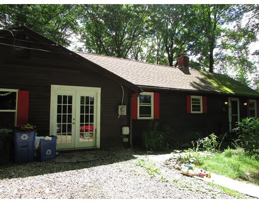 61 Searle Road Huntington, MA 01050 - Photo 4 of 16 a front view of a house with a yard