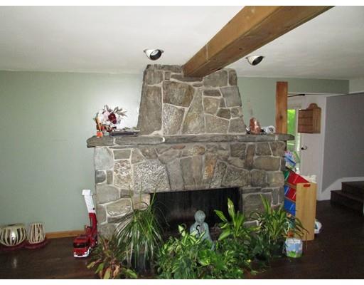61 Searle Road Huntington, MA 01050 - Photo 9 of 16 a living room with furniture and a fireplace