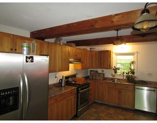 61 Searle Road Huntington, MA 01050 - Photo 10 of 16 a kitchen with stainless steel appliances granite countertop a refrigerator stove and sink