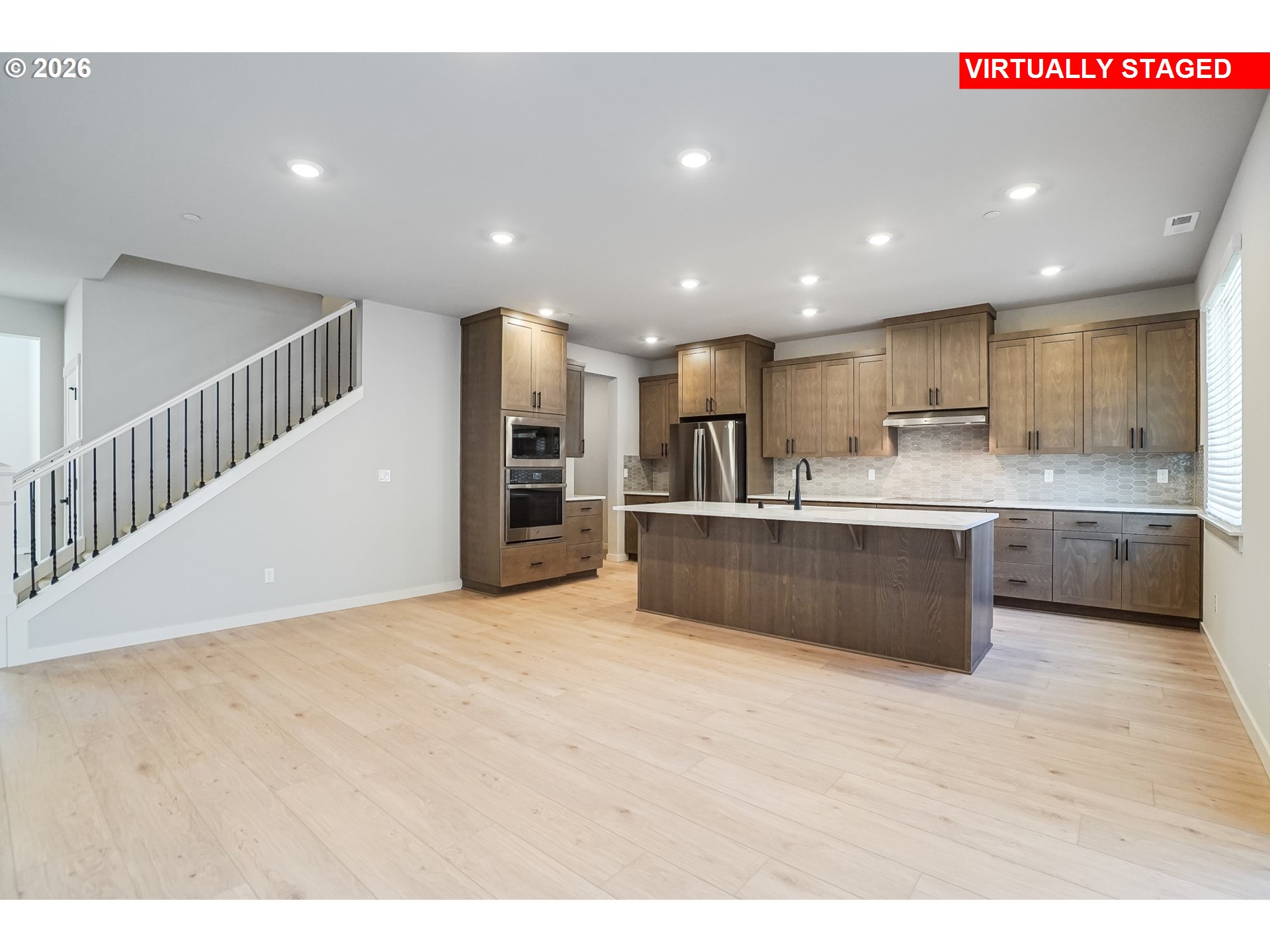 5297 North 87th Avenue Camas, WA 98607 - Photo 13 of 44 a large kitchen with stainless steel appliances kitchen island a large counter top a sink and a stove
