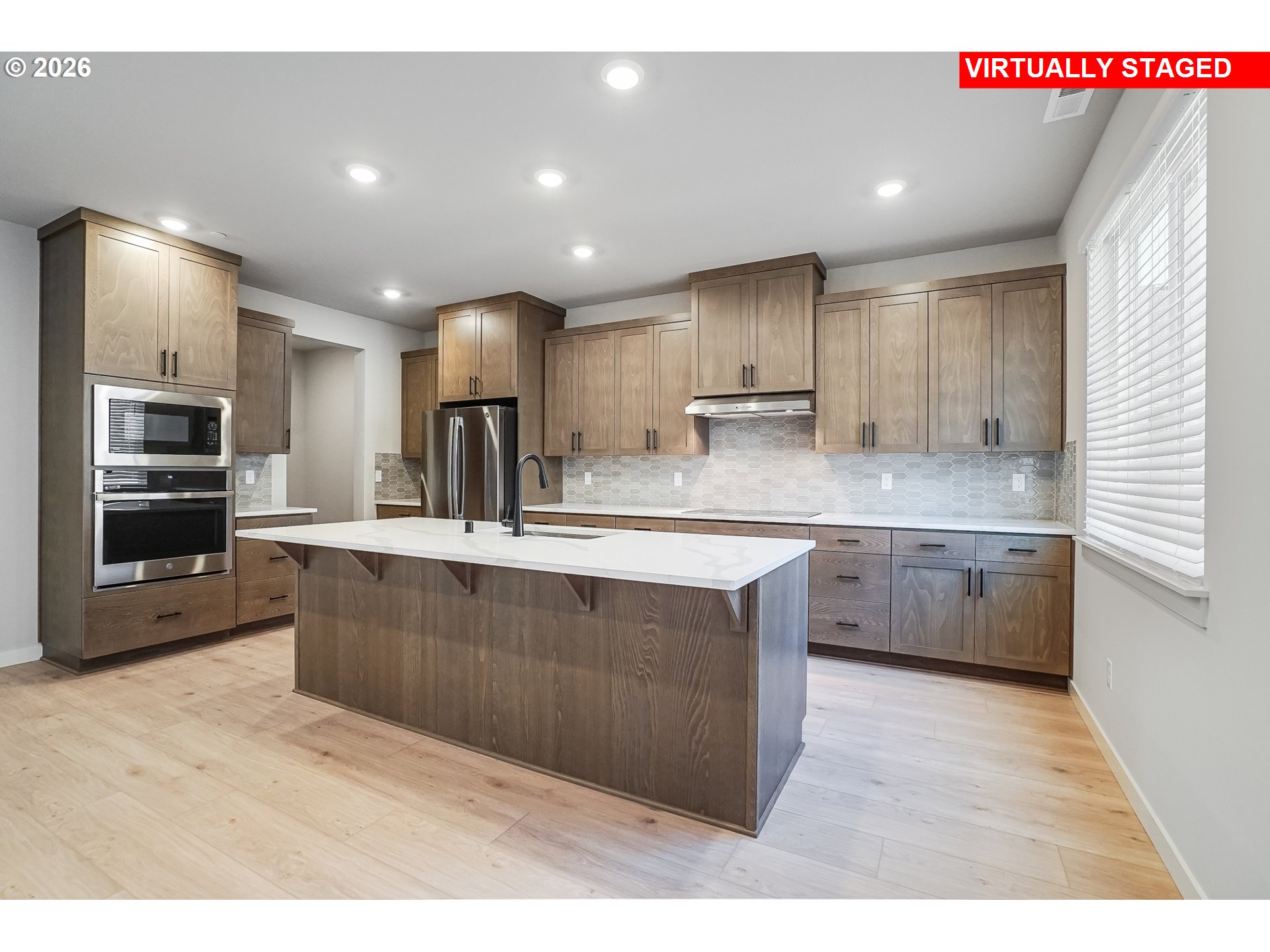 5297 North 87th Avenue Camas, WA 98607 - Photo 14 of 44 a kitchen with stainless steel appliances granite countertop a sink counter space cabinets and a sink