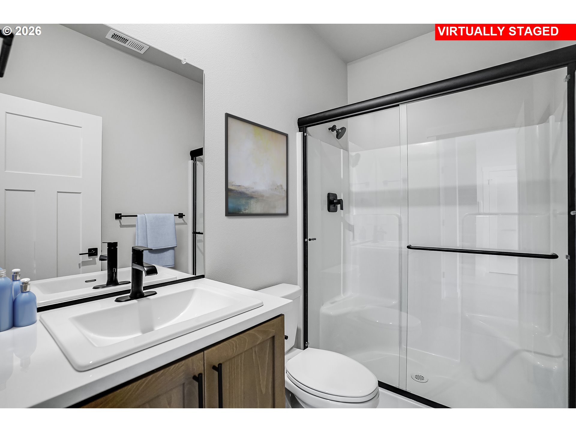 5297 North 87th Avenue Camas, WA 98607 - Photo 15 of 44 a bathroom with a sink toilet a mirror and shower
