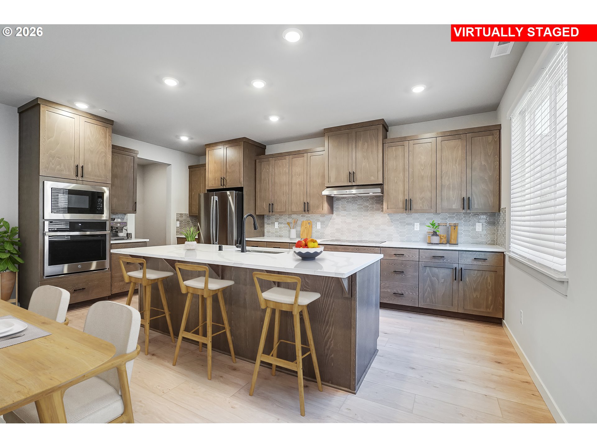 5297 North 87th Avenue Camas, WA 98607 - Photo 9 of 44 a kitchen with stainless steel appliances kitchen island granite countertop a sink counter space and chairs in it