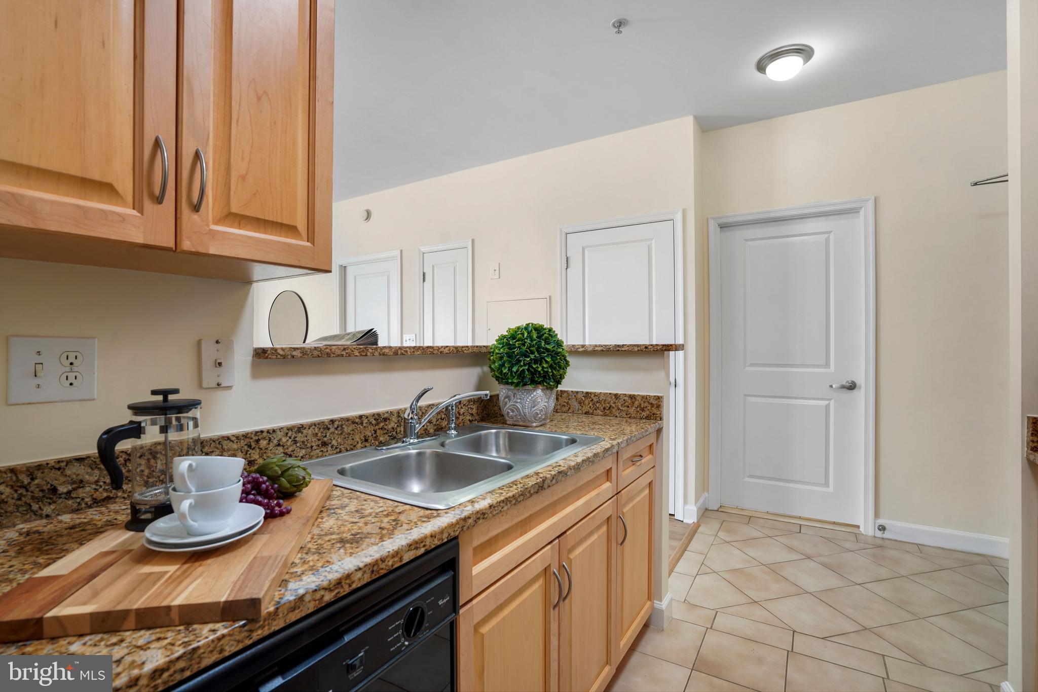 1111 25th Street Northwest, Unit 403 Washington, DC 20037 - Photo 11 of 24 a kitchen with a sink and cabinets