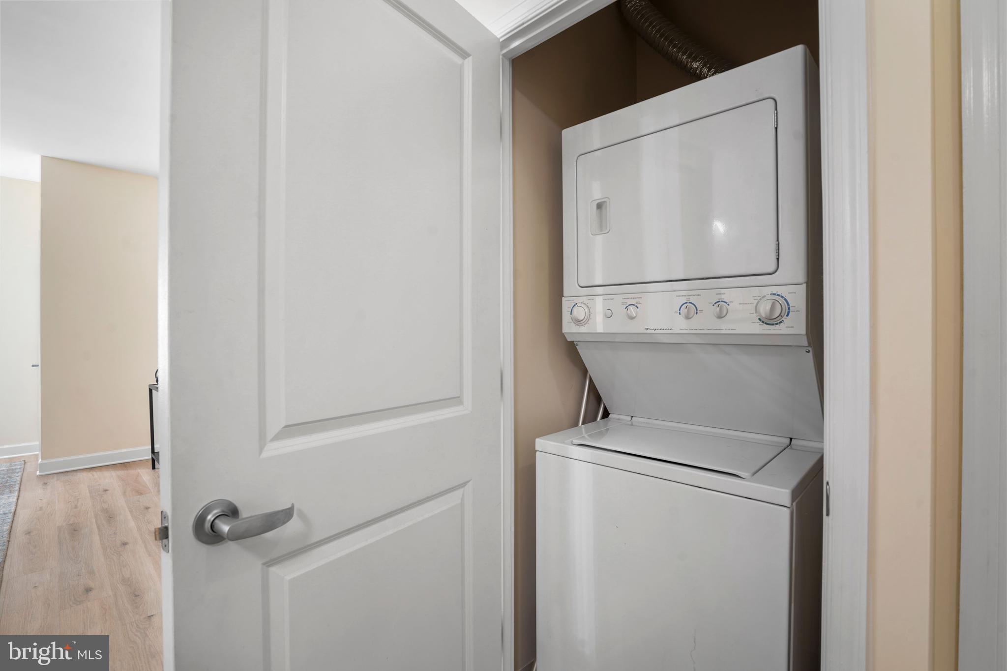 1111 25th Street Northwest, Unit 403 Washington, DC 20037 - Photo 16 of 24 a close view of a utility room with dryer and washer