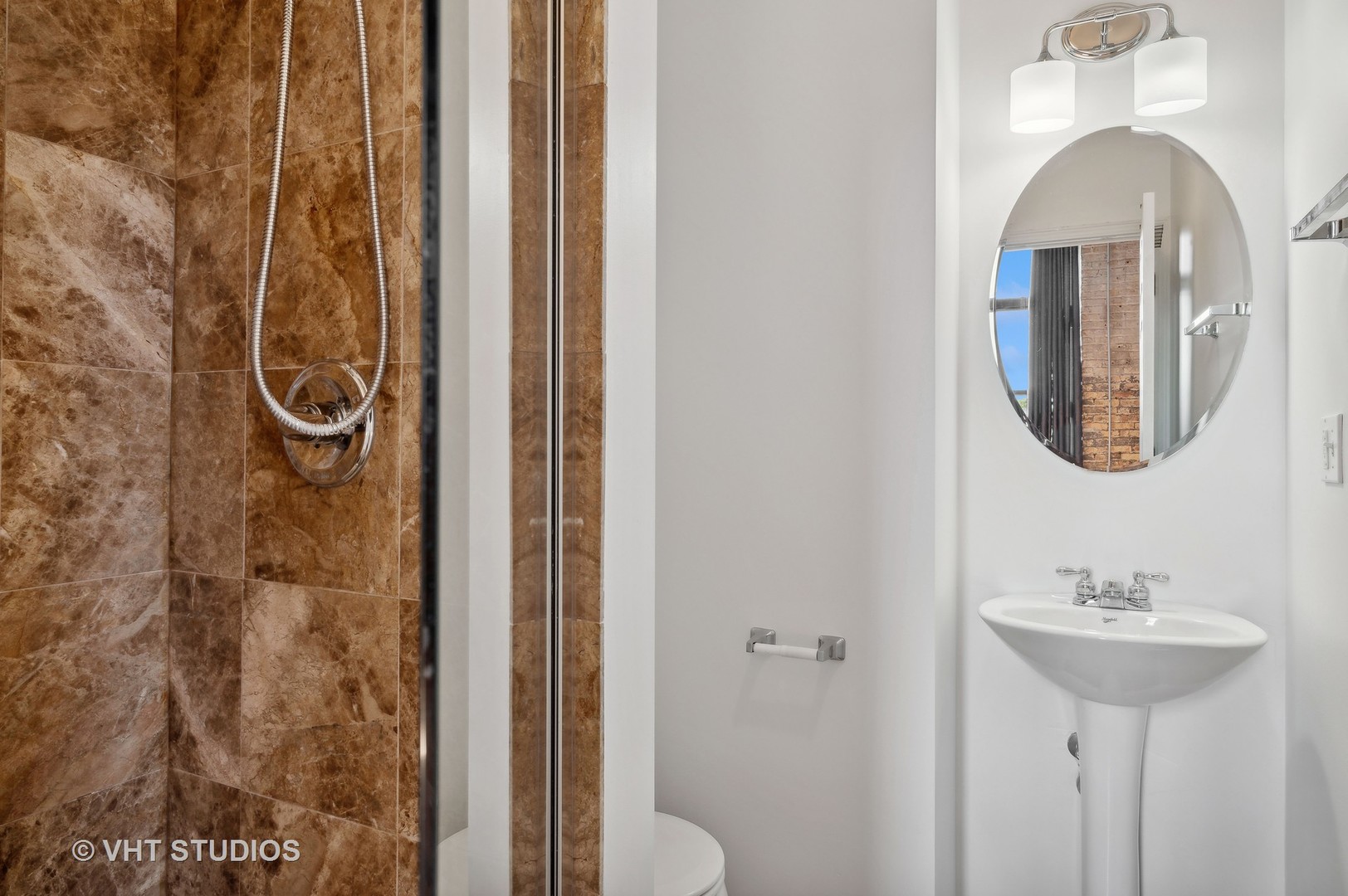 1820 North Spaulding Avenue, Unit 403 Chicago, IL 60647 - Photo 11 of 17 a bathroom with a sink and a mirror