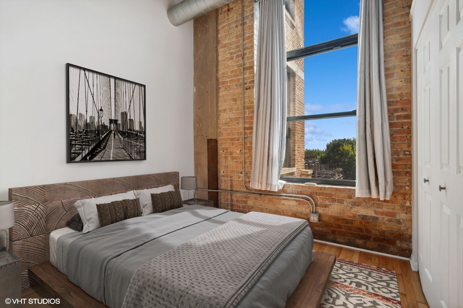 1820 North Spaulding Avenue, Unit 403 Chicago, IL 60647 - Photo 13 of 17 a bedroom with a large bed and a window