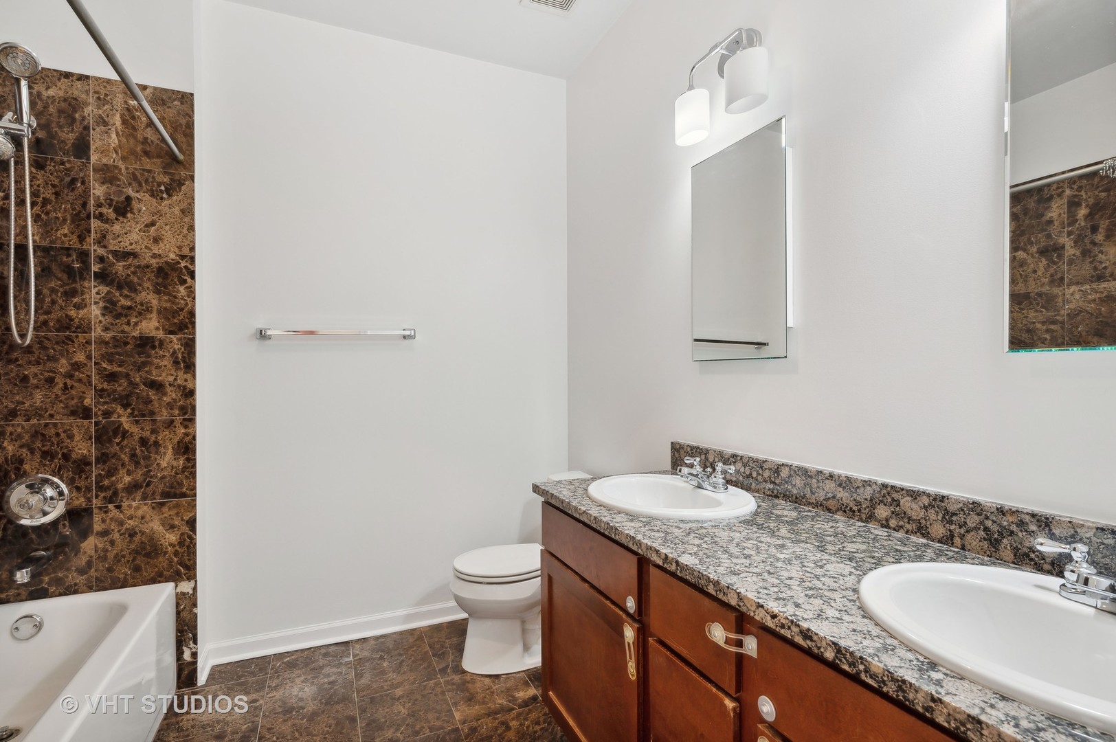 1820 North Spaulding Avenue, Unit 403 Chicago, IL 60647 - Photo 14 of 17 a bathroom with a granite countertop sink toilet and shower