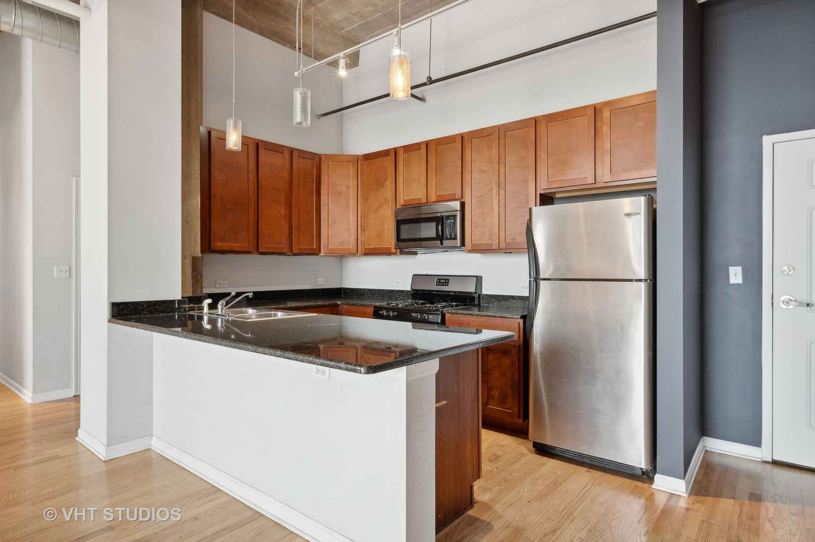 1820 North Spaulding Avenue, Unit 403 Chicago, IL 60647 - Photo 2 of 17 a kitchen with stainless steel appliances granite countertop a refrigerator a stove a sink and a microwave