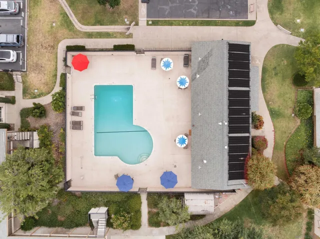 an aerial view of residential houses with outdoor space