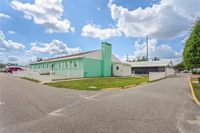 a view of a room with furniture and a chandelier