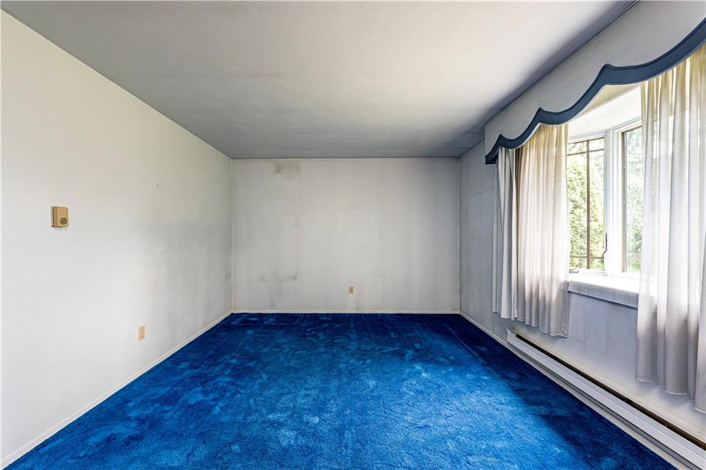 2037 Ridge Road Jeannette, PA 15644 - Photo 6 of 31 a view of empty room with wooden floor and fan