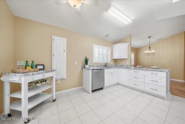 a kitchen with a stove top oven and cabinets