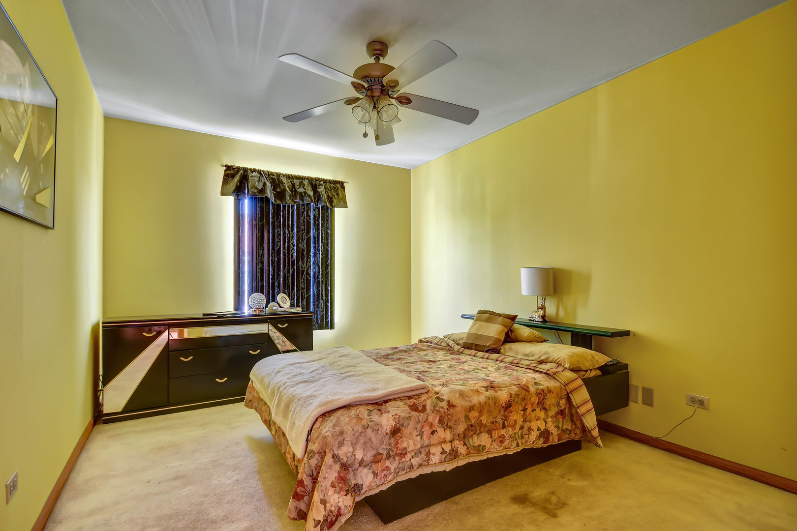 7420 Maple Drive Justice, IL 60458 - Photo 11 of 18 a bedroom with a bed and a chandelier