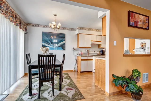 a kitchen with stainless steel appliances kitchen island granite countertop a stove a sink and a microwave