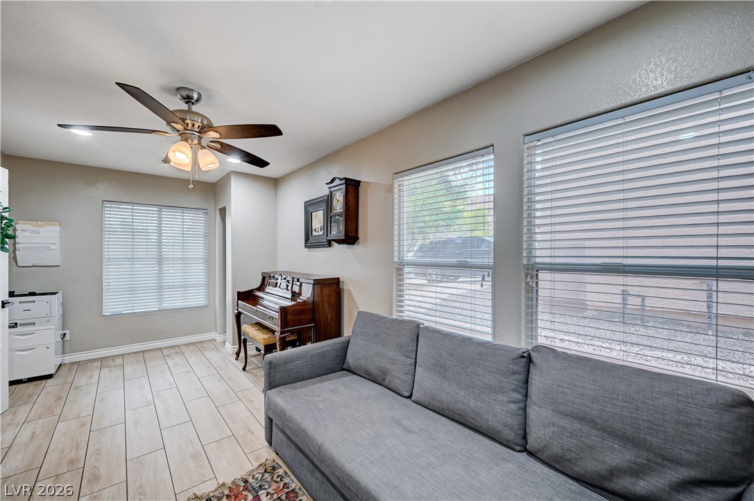 197 Kings Canyon Court Henderson, NV 89012 - Photo 14 of 39 Living room with ceiling fan and light wood-type flooring