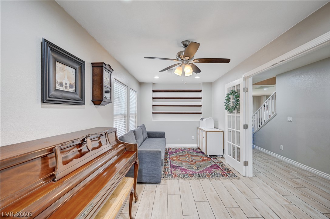 197 Kings Canyon Court Henderson, NV 89012 - Photo 15 of 39 Living area with stairway, ceiling fan, light wood-style flooring, and recessed lighting