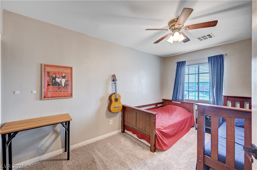 197 Kings Canyon Court Henderson, NV 89012 - Photo 28 of 39 Bedroom with carpet floors and a ceiling fan