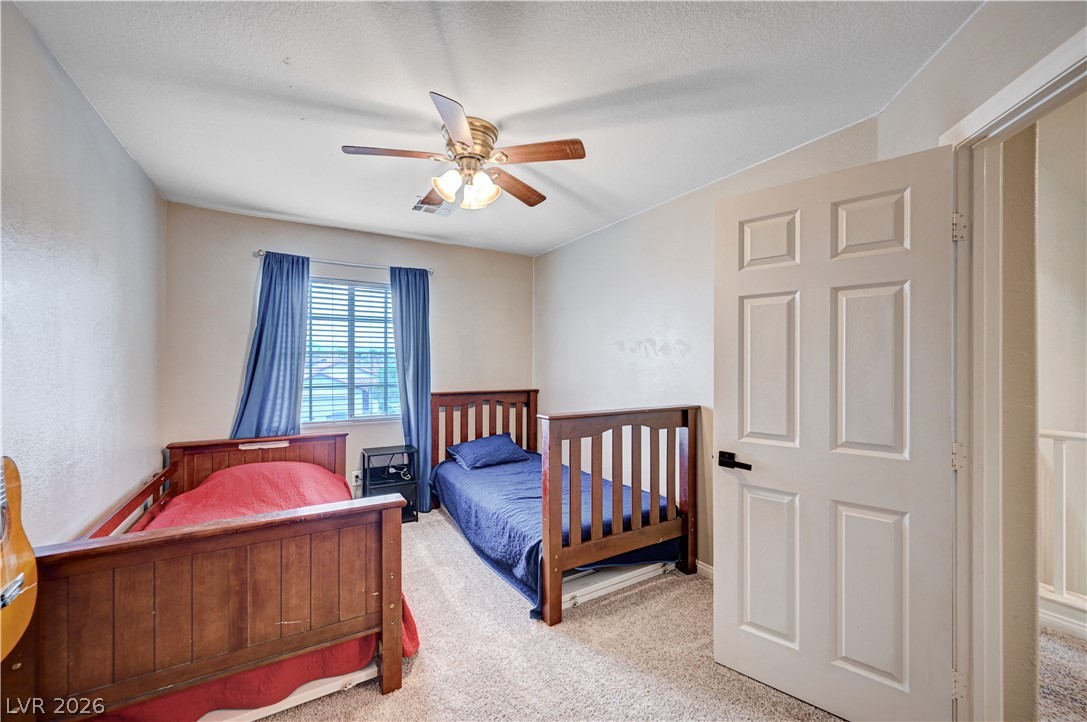 197 Kings Canyon Court Henderson, NV 89012 - Photo 29 of 39 Bedroom featuring carpet flooring and a ceiling fan