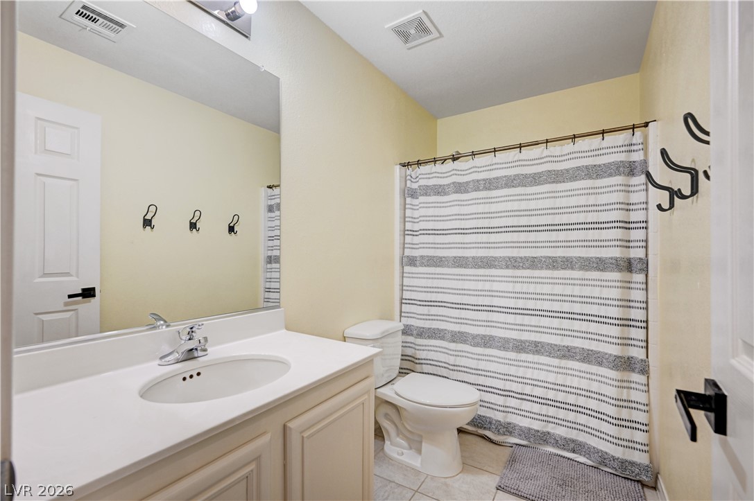 197 Kings Canyon Court Henderson, NV 89012 - Photo 32 of 39 Bathroom with vanity and tile patterned flooring