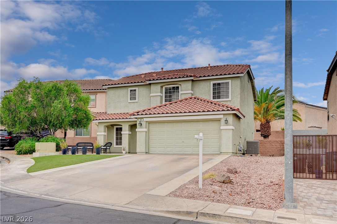 197 Kings Canyon Court Henderson, NV 89012 - Photo 39 of 39 Mediterranean / spanish-style house featuring stucco siding, driveway, an attached garage, and a tiled roof