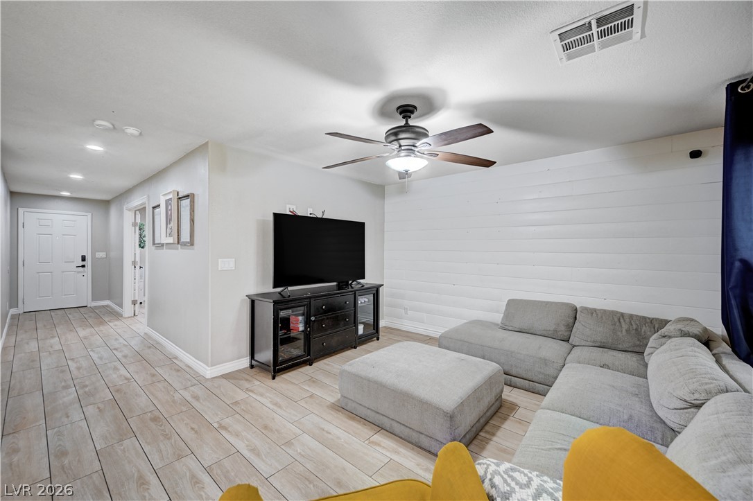 197 Kings Canyon Court Henderson, NV 89012 - Photo 5 of 39 Living area featuring a ceiling fan, light wood-type flooring, and recessed lighting