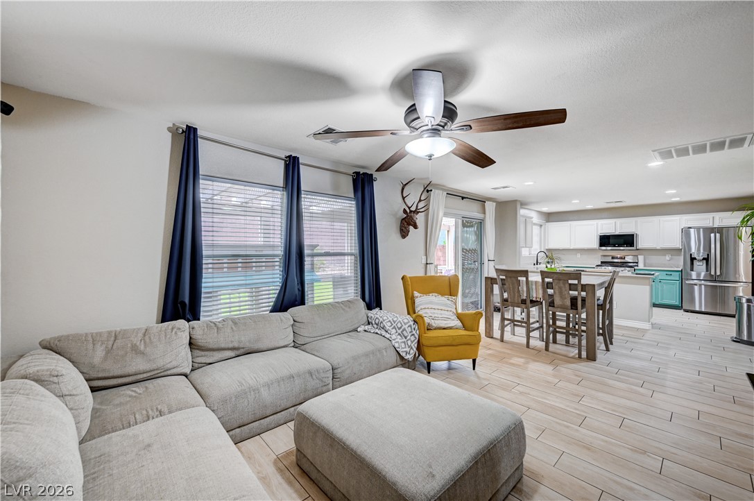 197 Kings Canyon Court Henderson, NV 89012 - Photo 6 of 39 Living area with ceiling fan, light wood-style floors, and recessed lighting