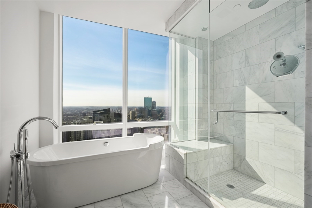 1 Franklin Street, Unit 4802 Boston, MA 02110 - Photo 20 of 42 a bathroom with a bathtub and shower