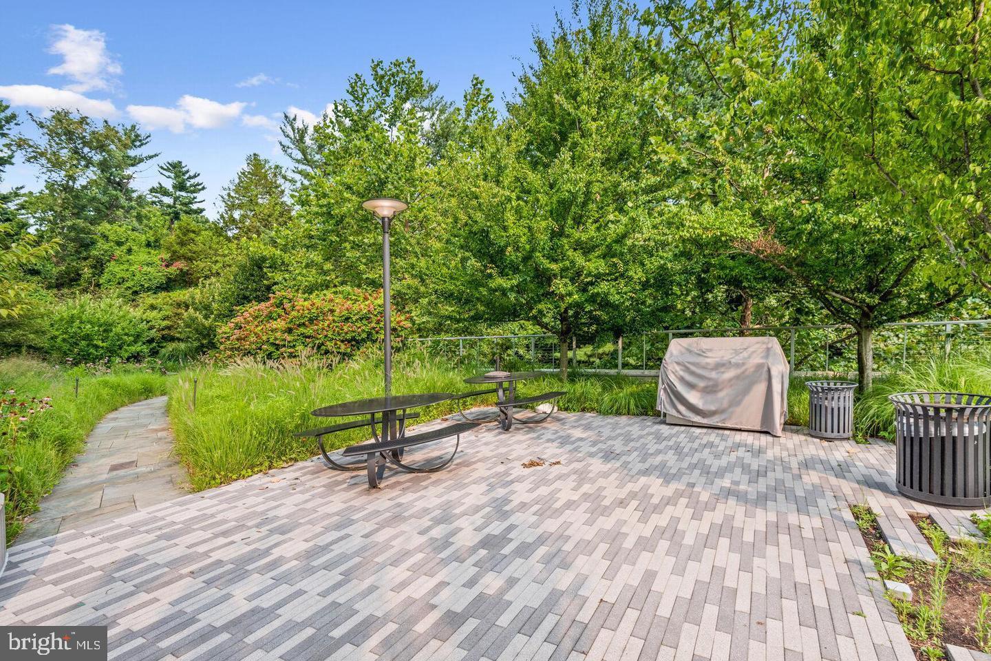5101 River Road, Unit 1904 Bethesda, MD 20816 - Photo 35 of 43 a view of a bench in a backyard