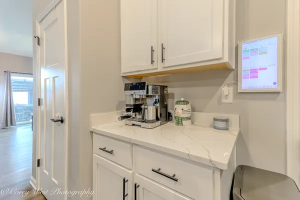 a kitchen with a sink cabinets and utility