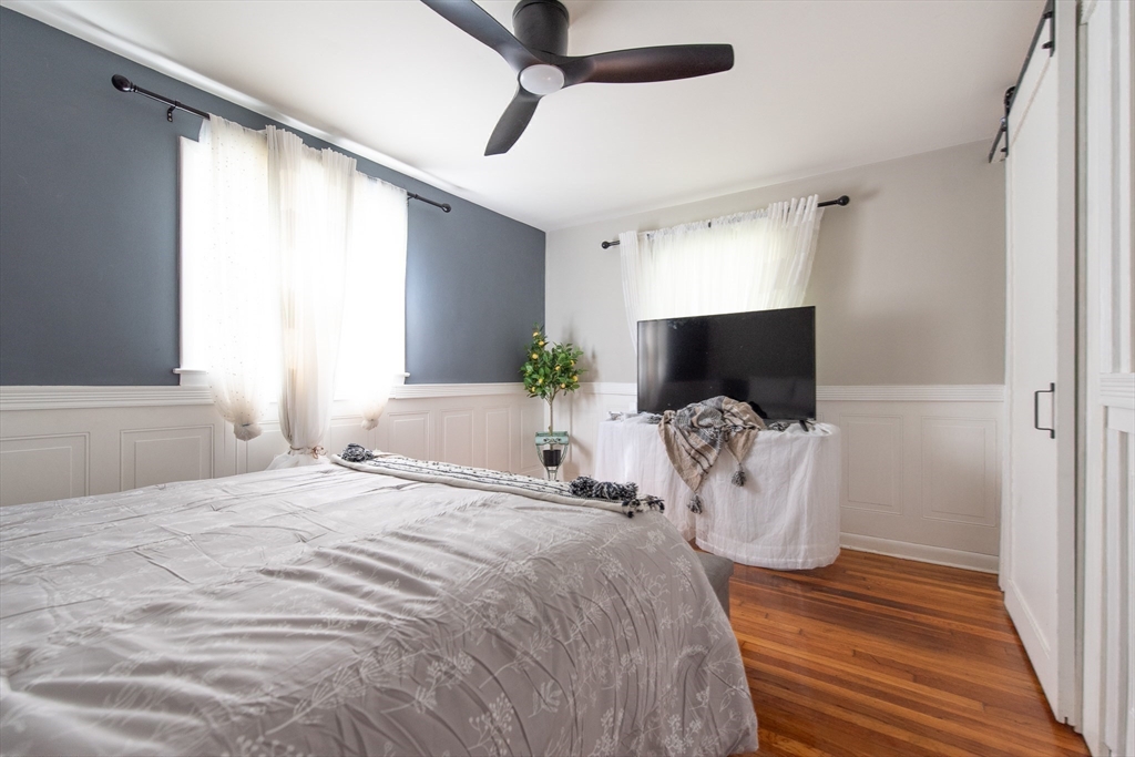 82 Patton Road Woonsocket, RI 02895 - Photo 12 of 31 a bedroom with a bed and flat screen tv