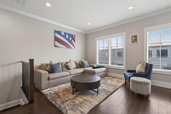 a living room with furniture and a rug