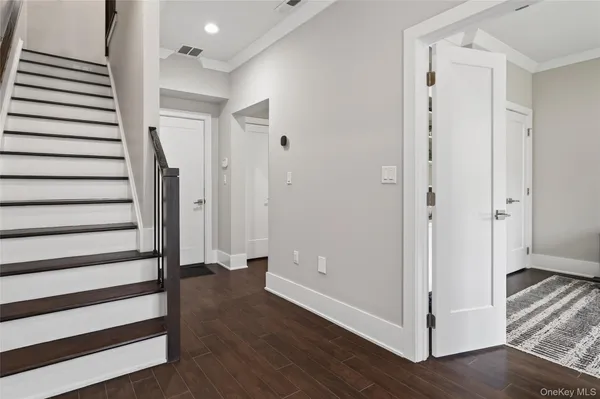 a view of entryway with wooden floor